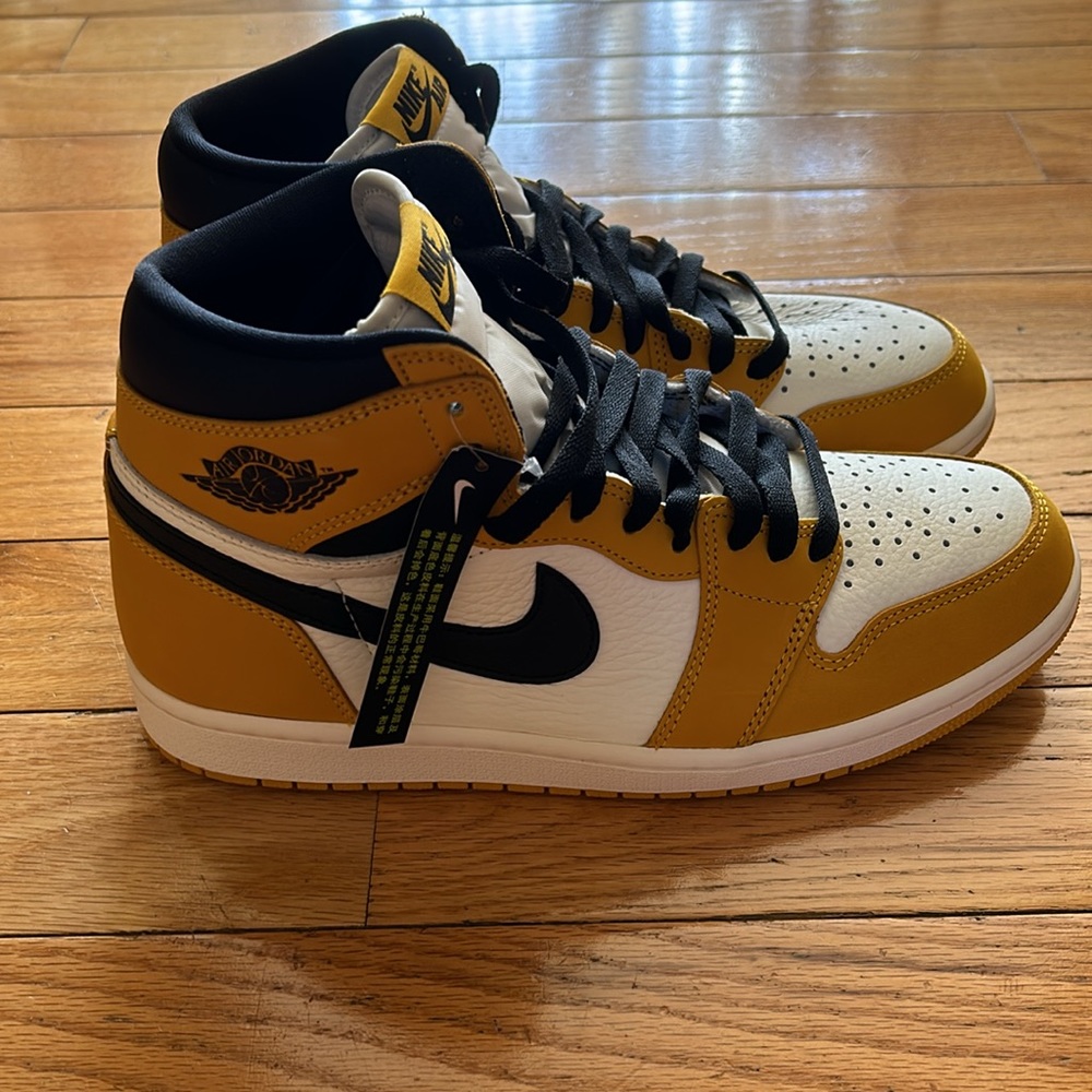 Nike Air Retro yellow and black high top sneakers